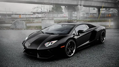 Black Aventador on a Rainy Industrial Lot HD Wallpaper