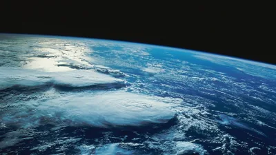Low Orbit View of Sunlit Clouds HD Wallpaper