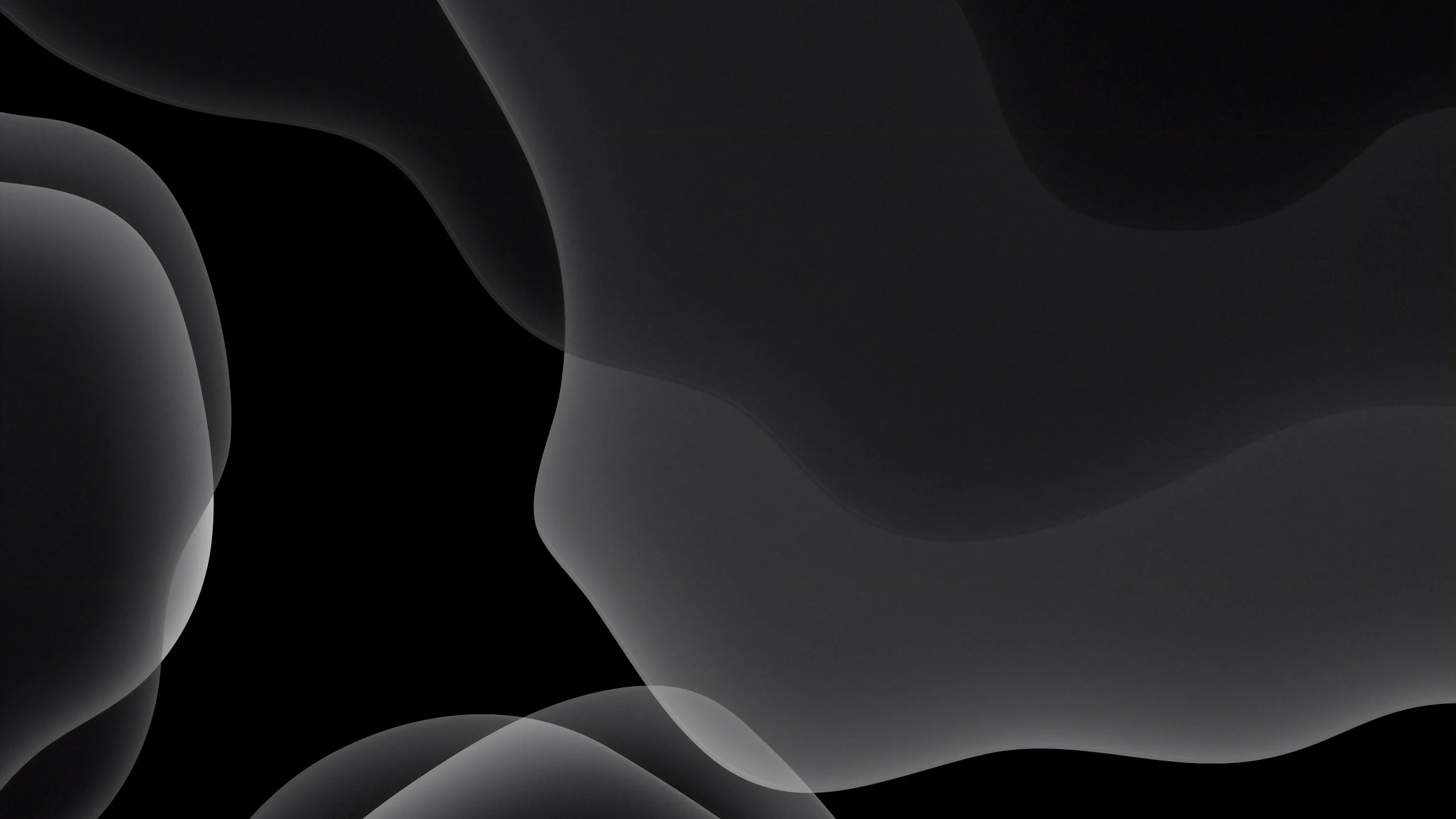 Translucent rounded shapes drift over each other in greys, leaving the lower left corner clear for icons.