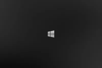 The Windows 8 logo sits alone at the centre of a soft charcoal gradient, tone falling off evenly toward all four corners.