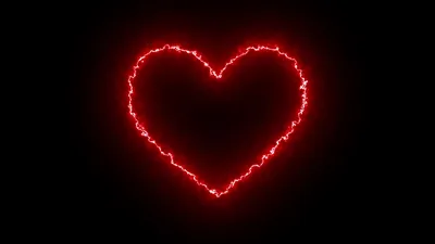 Burning red heart on black background