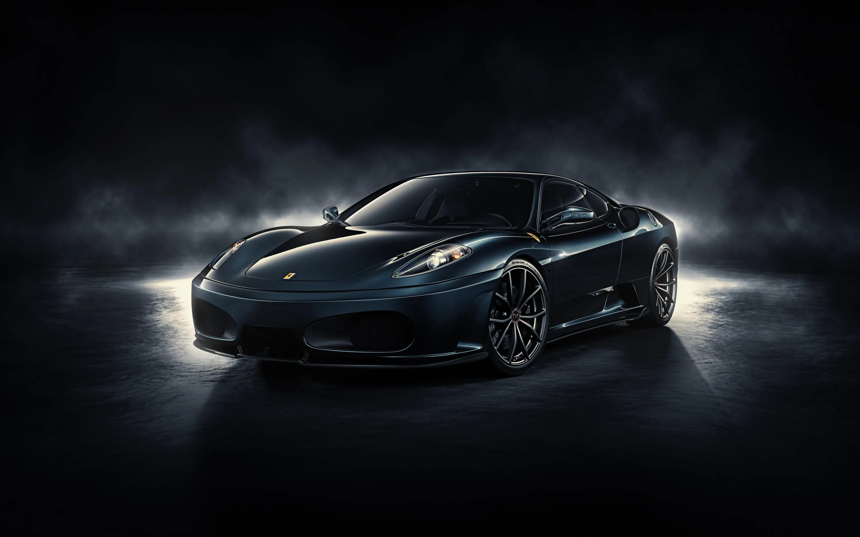 Beams from behind throw pale fog around a black F430, leaving the bonnet and windscreen dark while the outline glows.