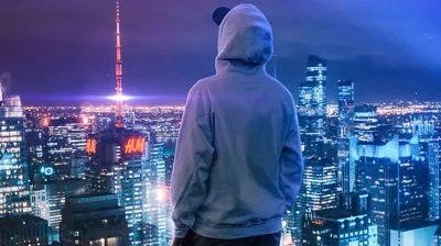 Boy on a Rooftop Above a Neon City HD Wallpaper