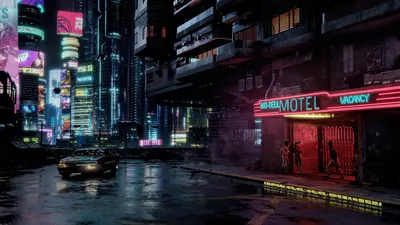 Neon Motel Sign on a Wet Street HD Wallpaper