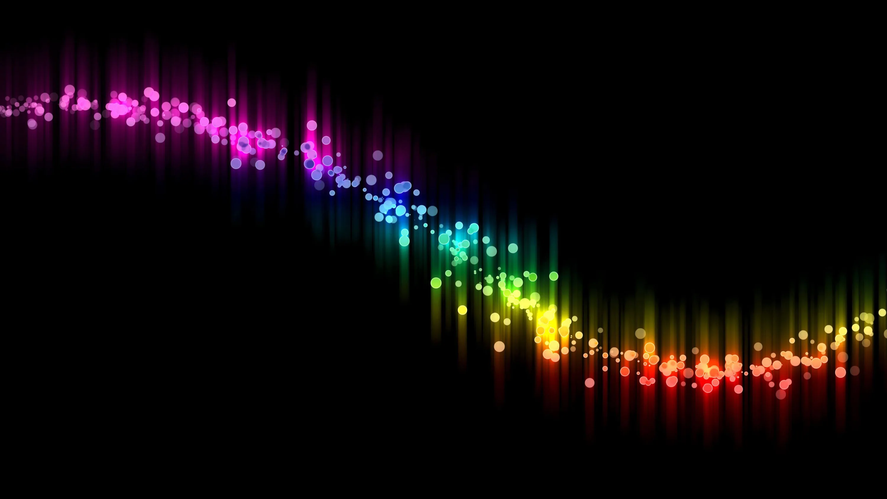 A band of coloured points curves through the frame like a sound wave, brightest at the crest.