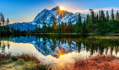Sun Flare Over a Reflected Snow Peak HD Wallpaper