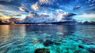 Towering Clouds Over Clear Reef Water HD Wallpaper