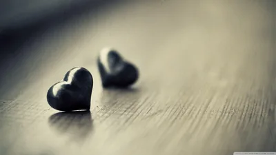 Two Stone Hearts on a Wooden Table HD Wallpaper