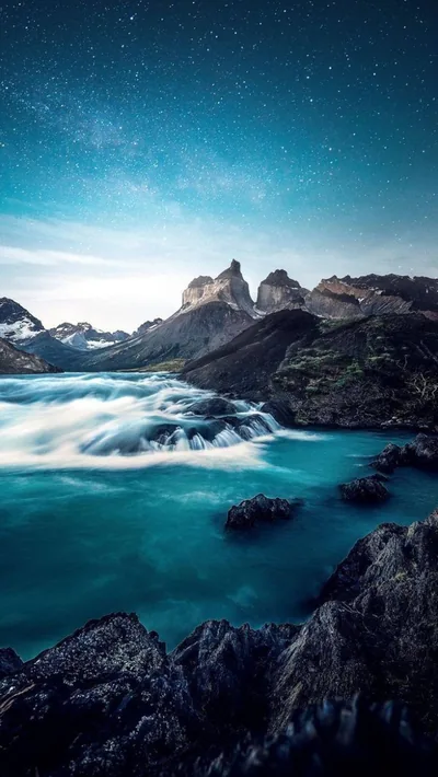 Turquoise River Below Jagged Peaks HD Phone Wallpaper