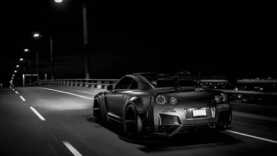 Nissan GT-R on a Night Highway in Monochrome HD Wallpaper