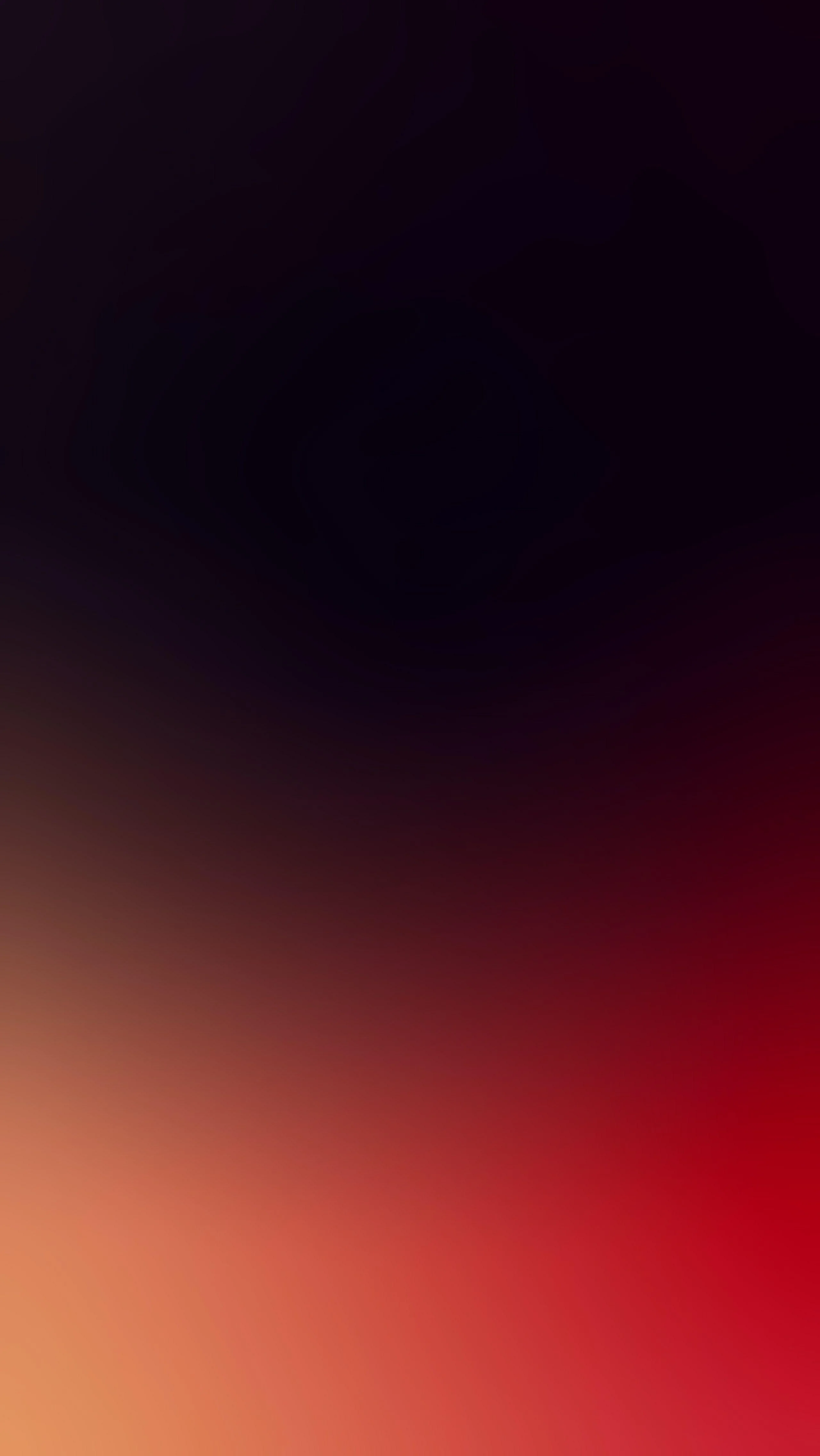 A soft gradient runs from near-black purple at the top down to warm red and orange, blurred with no hard edge anywhere.