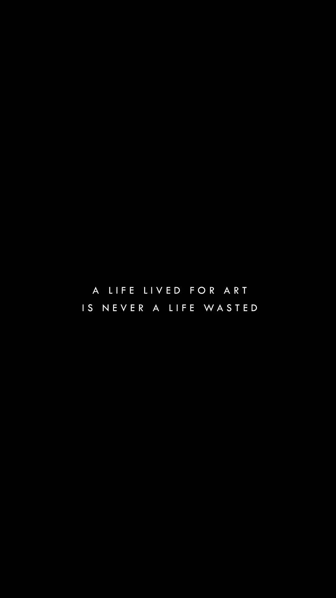 Two lines of thin white letter-spaced text sit just below centre on solid black, nothing else in the frame — good for OLED panels.