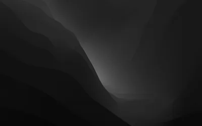 Smooth grey ridges fold into one another under a pale glow — a minimal, almost fog-bound landscape.