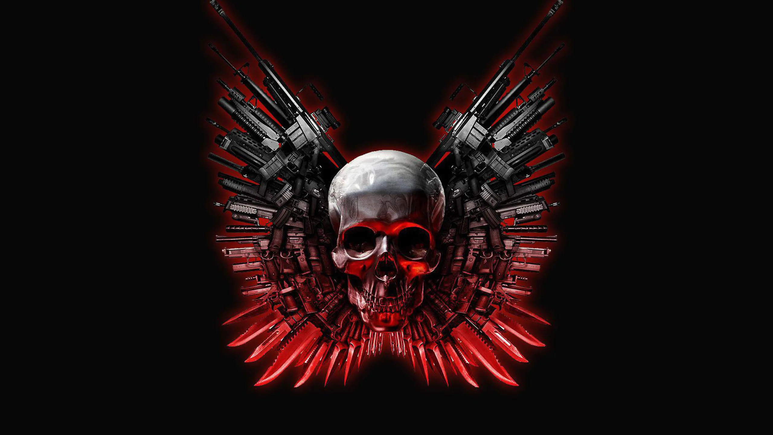 A chrome skull with red-lit eyes sits at the centre of two mechanical wings built from revolvers and rifle barrels, mounted on solid black.