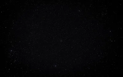Starry Black Sky with Soft Glow HD Wallpaper