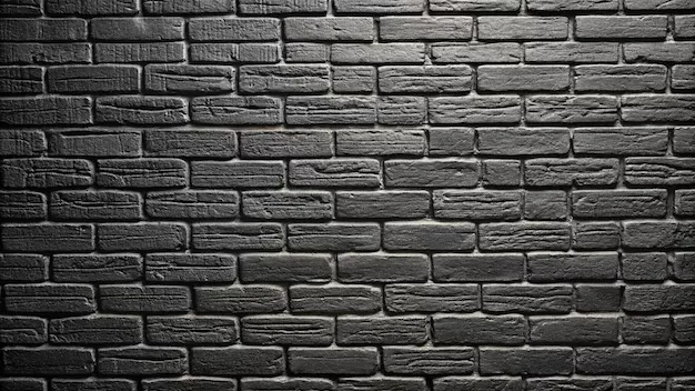 Thickly painted brick in flat grey, the light entering from the upper right so the mortar lines throw small shadows.