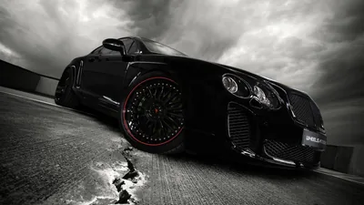 Bentley with Red Rims Under Storm Clouds HD Wallpaper