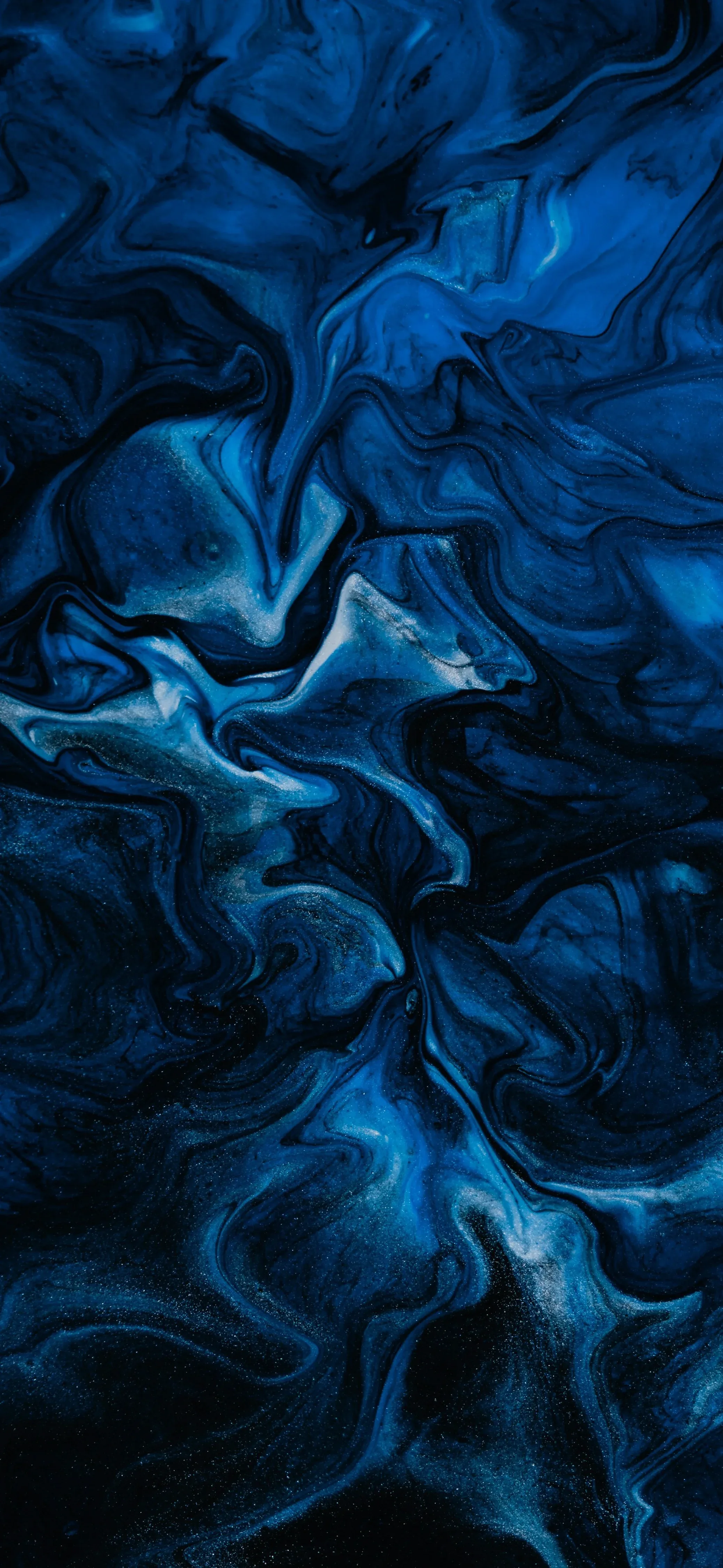 Cobalt and black swirl together like ink on water, the brightest veins running through the centre while the corners sink to near-black.