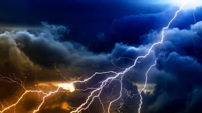 Forked Lightning in Orange Storm Clouds HD Wallpaper