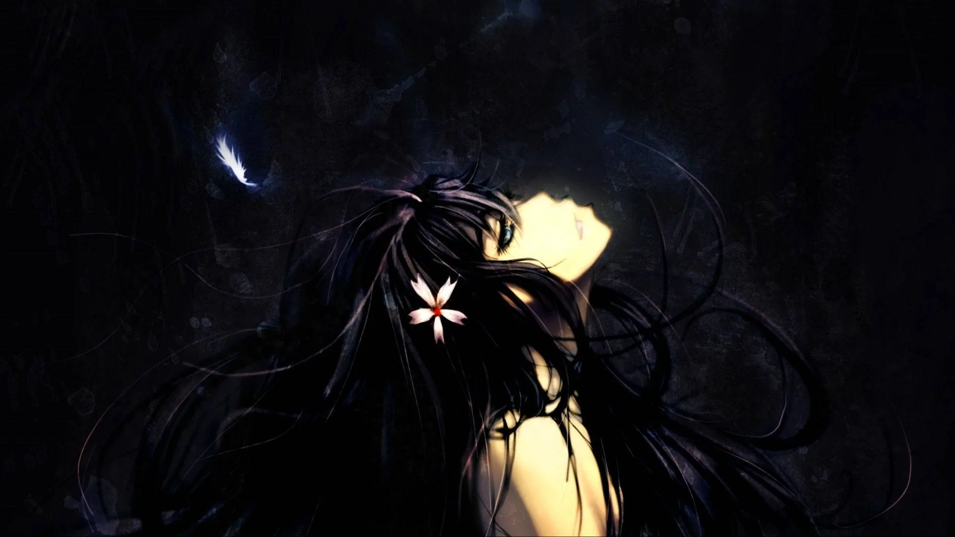 A figure leans back into deep shadow with hair spreading across the whole lower frame, one pale flower and a slice of lit shoulder the only things not black.