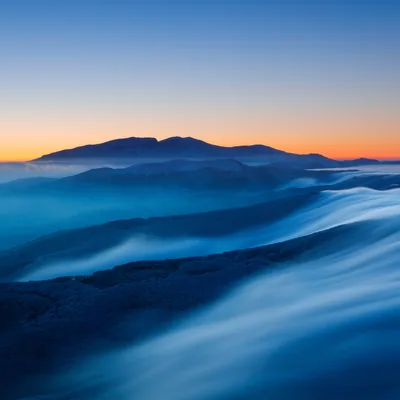 Blue Fog Flowing Over Dark Hills HD Wallpaper
