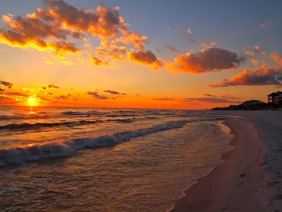 Waves Rolling In Under Scattered Clouds HD Wallpaper