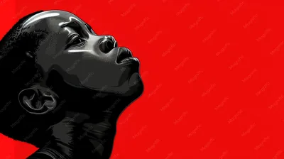 A young black boy gazes upward against a vibrant red backdrop