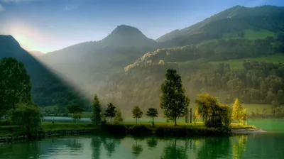 Sunbeam Cutting Through Mountain Haze HD Wallpaper