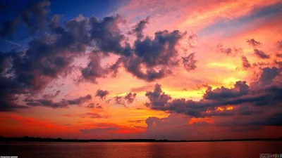 Dark Clouds over a Sunset Lake HD Wallpaper