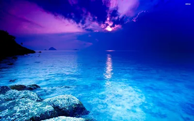 Glowing Blue Cove Under a Purple Sky HD Wallpaper