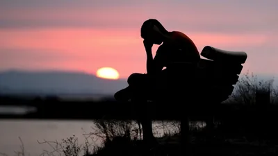 Heartbroken Man on a Bench at Sunset HD Wallpaper