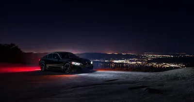 Dark Sedan on a Hilltop Above City Lights HD Wallpaper