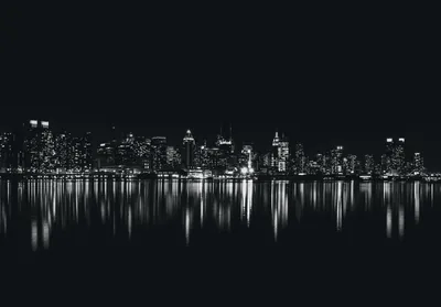 City Skyline Mirrored in Black Water HD Wallpaper