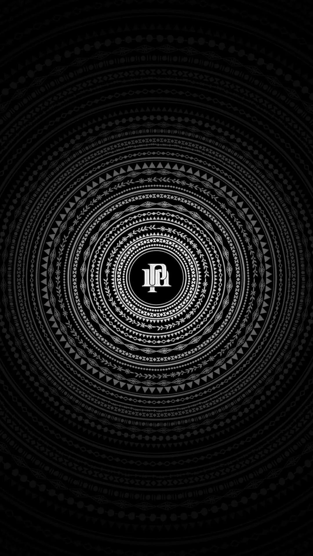 Rings of small dots and dashes ripple outward from a tiny white emblem at the centre, everything else charcoal on black.