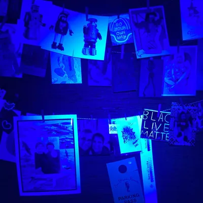Photo Wall Under Blue Blacklight HD Wallpaper