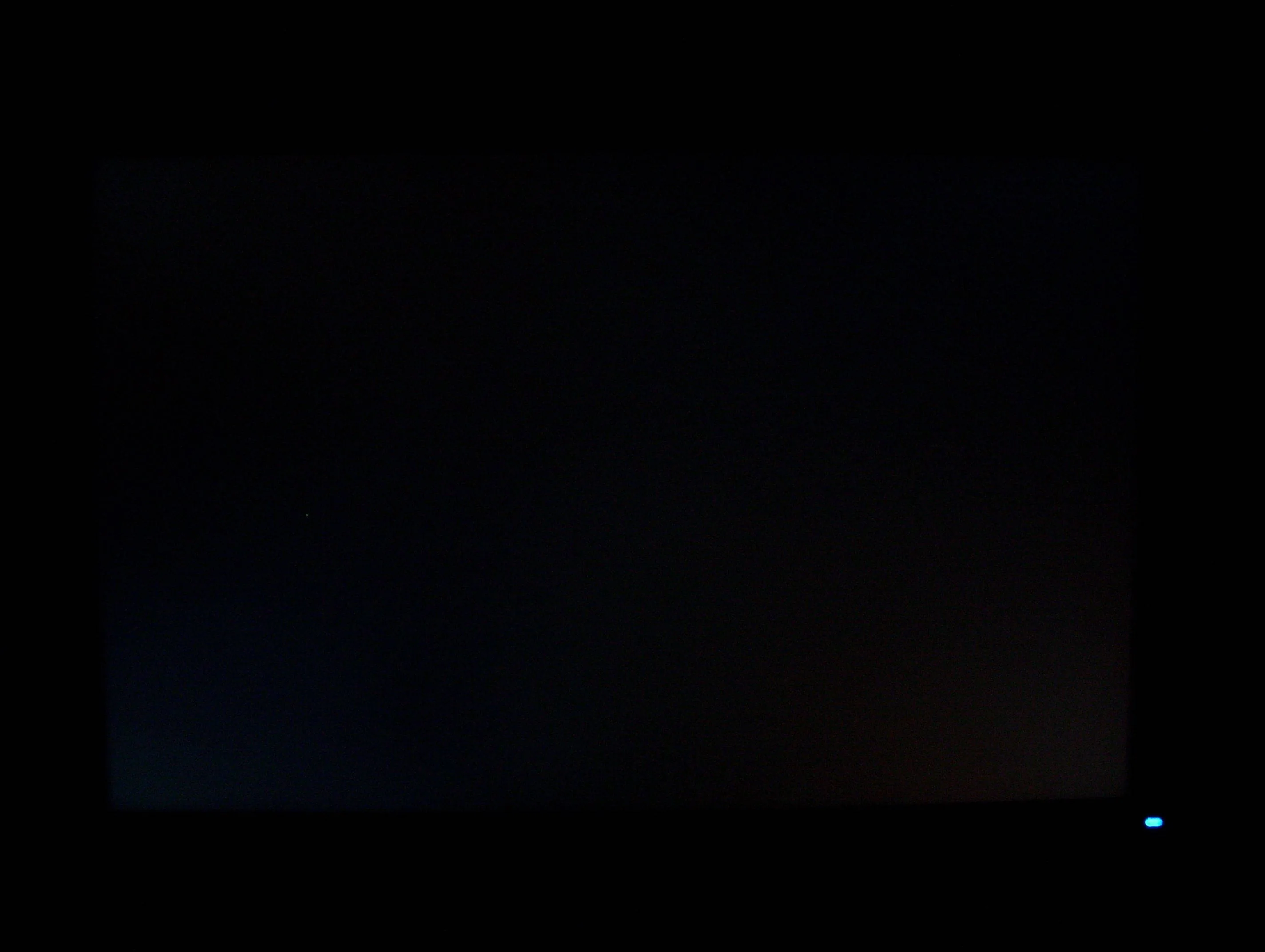 Anonymous Man In Pitch Black Background Wallpaper