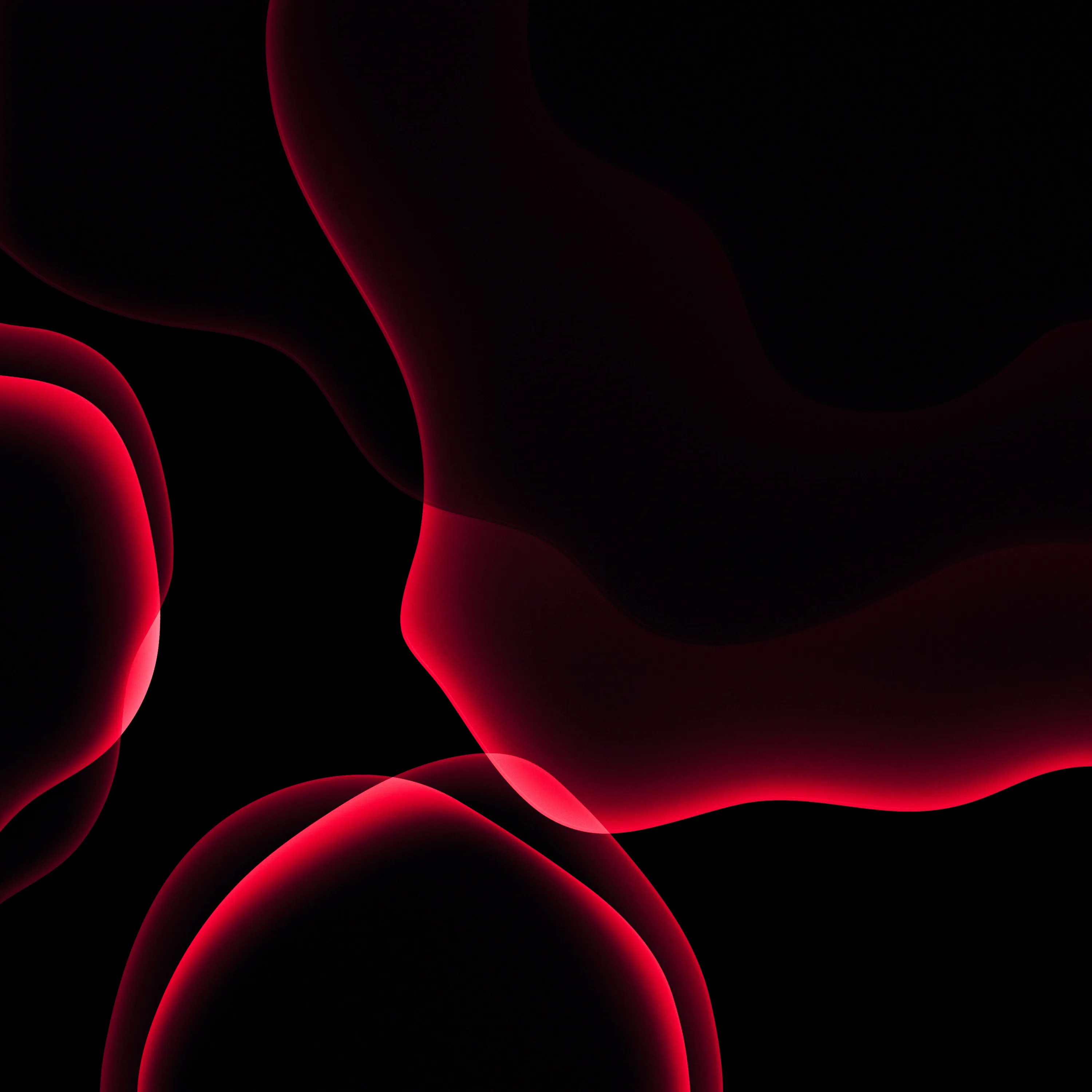 Rounded red shapes overlap on deep black, their edges lit like backlit glass while the corners stay unlit.
