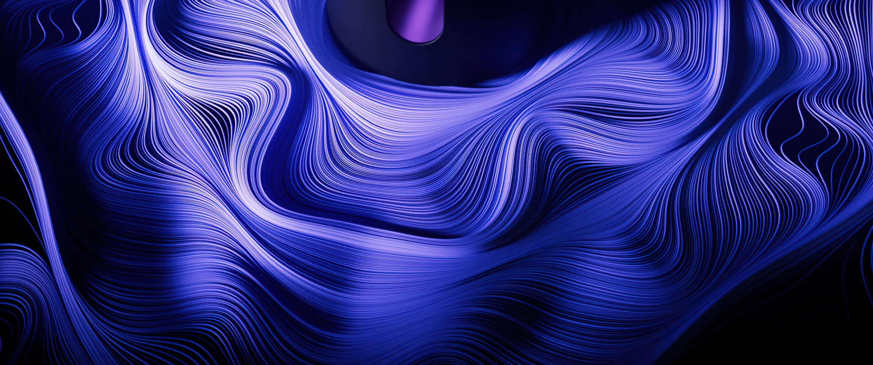 Thousands of fine strands bend and fold like brushed silk, electric blue in the light and near-black where they turn away.
