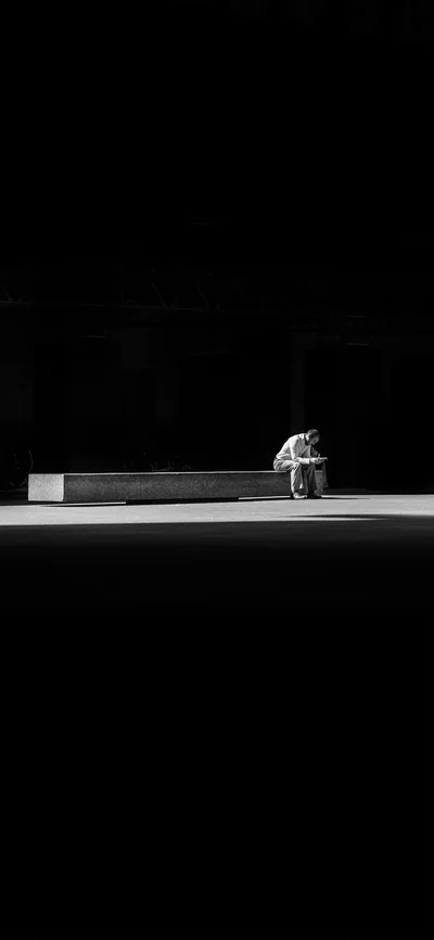 Hunched on a Concrete Bench HD Phone Wallpaper
