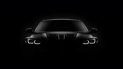 BMW Silhouette with Glowing Headlights HD Wallpaper