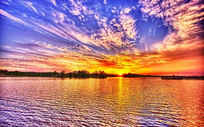 Colorful Sunset over a Rippled Lake HD Wallpaper