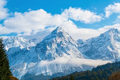 Winter Alps Under Broken Clouds HD Wallpaper