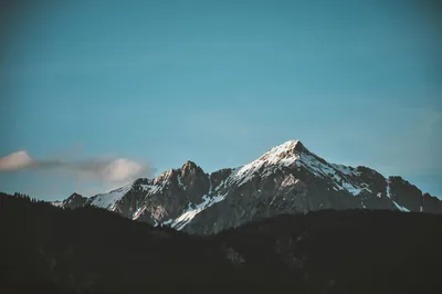 Twilight Over a Snow-Dusted Summit HD Wallpaper