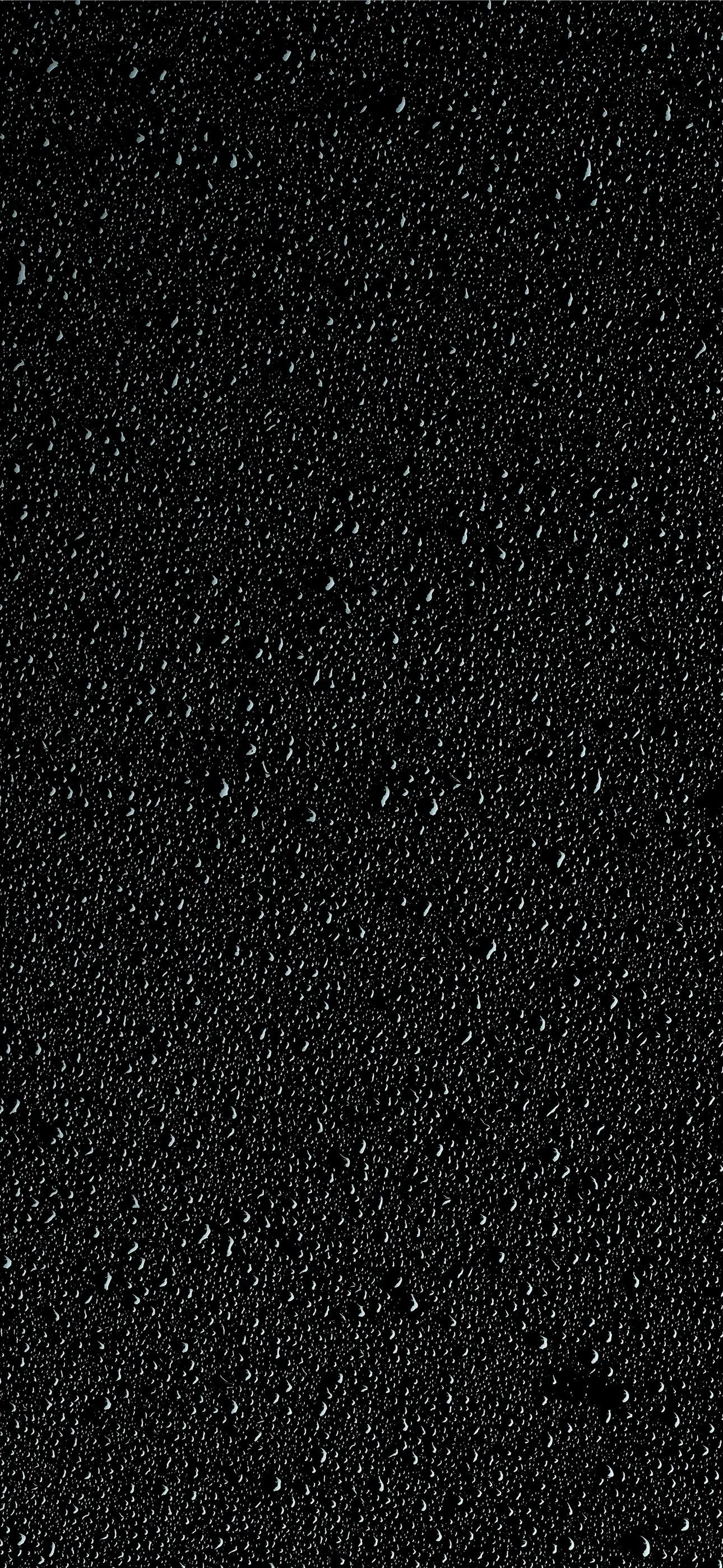 a black background with small bubbles of water iPhone Wallpapers
