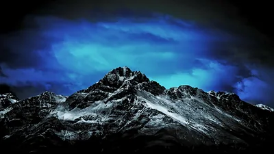 Snowy Mountain Peak under a Dark Blue Sky HD Wallpaper