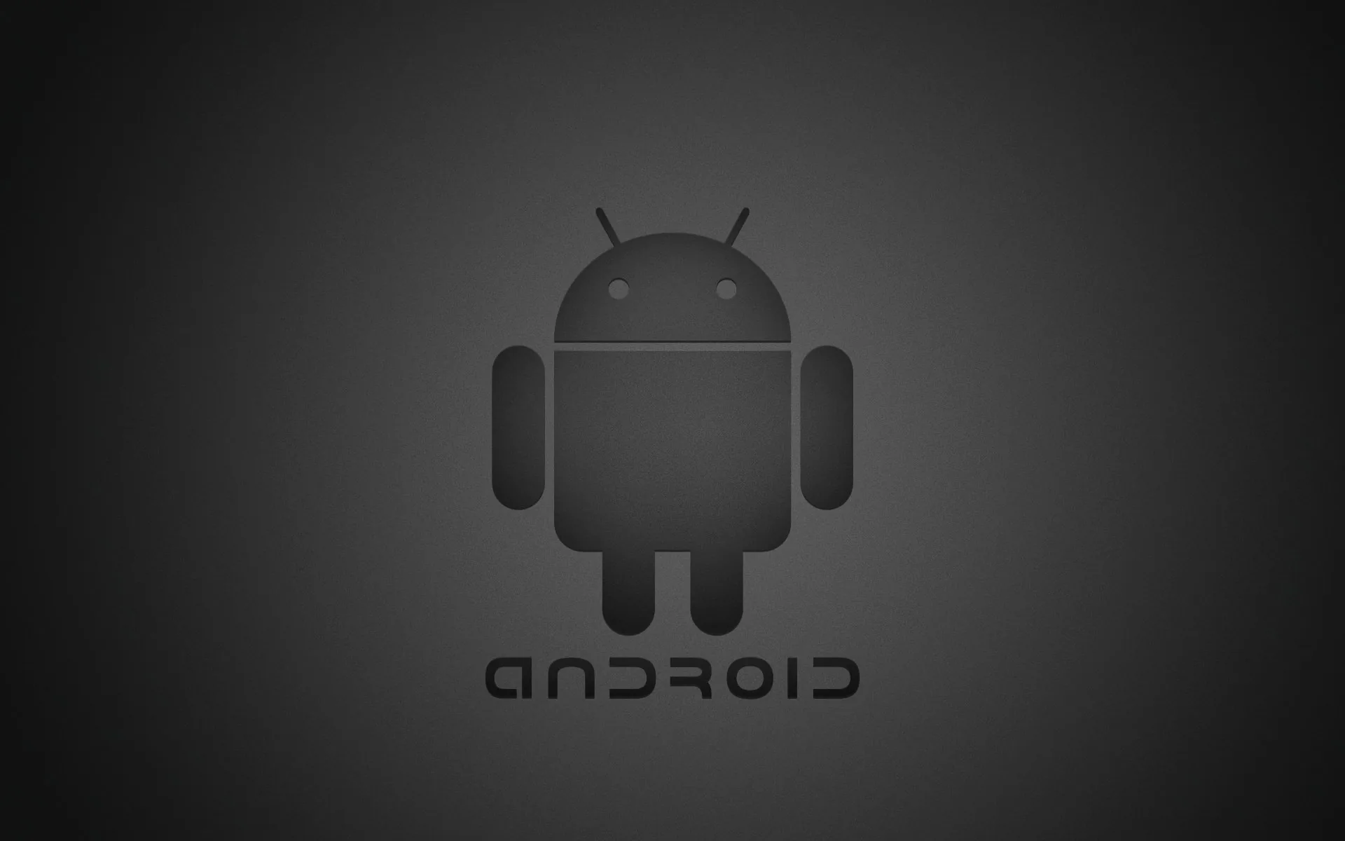 The Android robot in matte grey sits centred on a charcoal gradient, the wordmark set below it in slightly darker type.