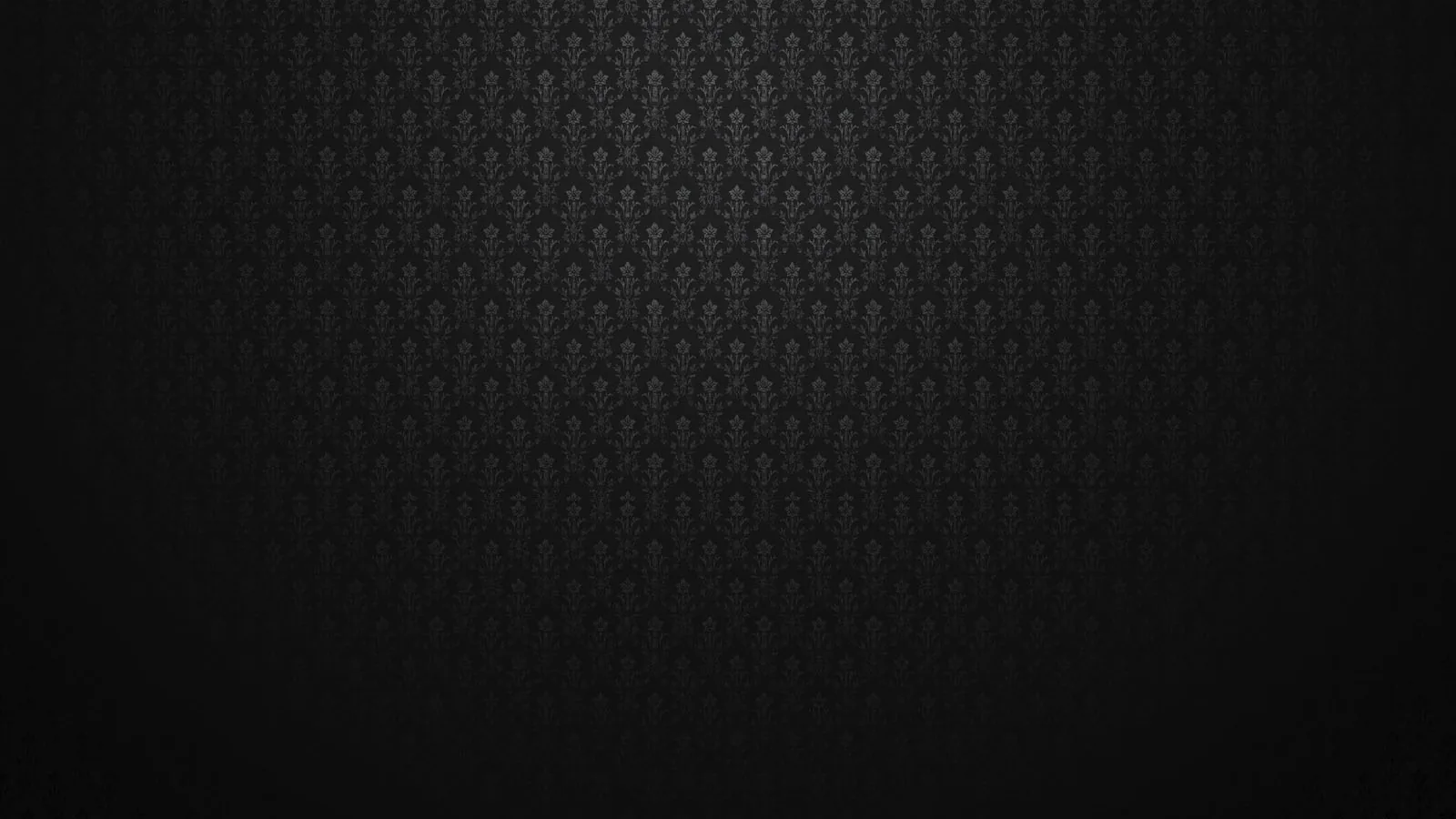 A small fleur-de-lis motif tiles across the upper half in dark grey, the bottom third left as plain black where the light drops off.