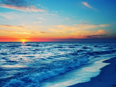 Sun Setting Over a Blue Surf Beach HD Wallpaper