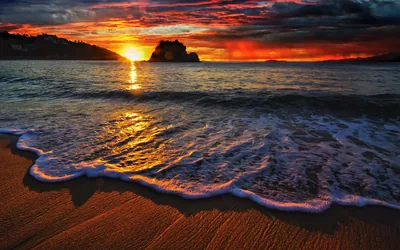 Crashing Wave Under a Red Sunset HD Wallpaper