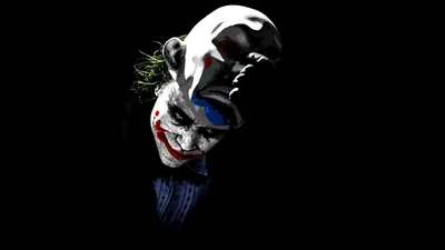 Tilted Joker Face Out of Darkness HD Wallpaper